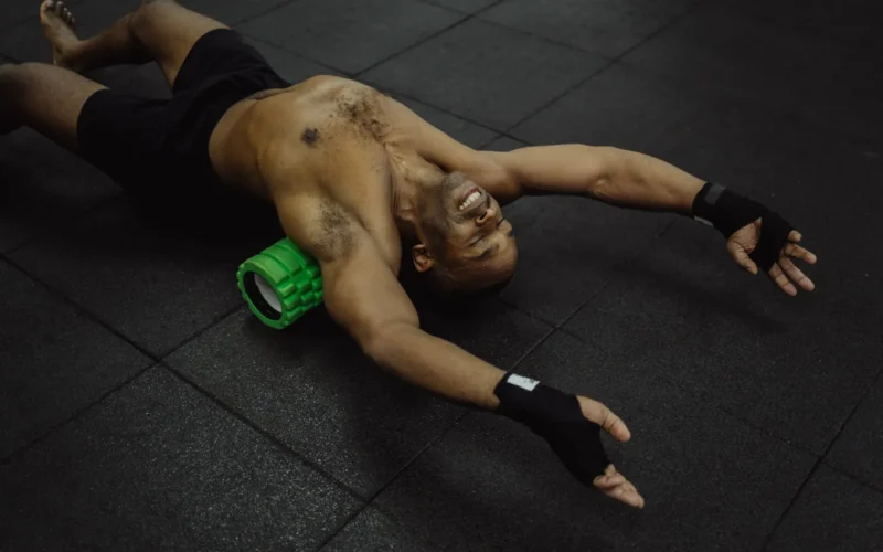 Foam rollers in soft, medium, and high-density arranged by size on a gym floor