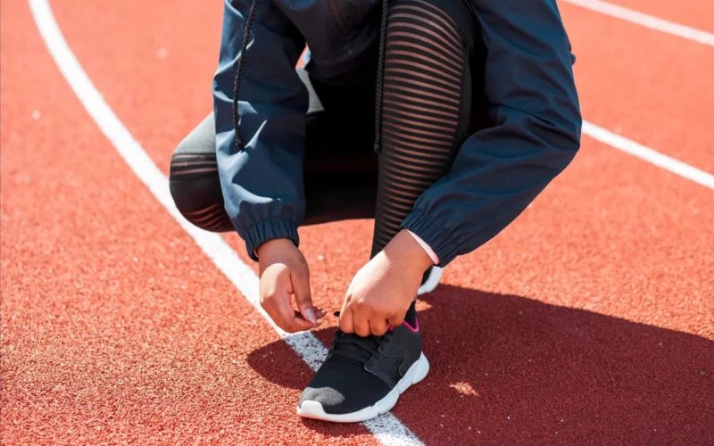 Runner's foot wet-print on cardboard showing low arch for overpronation gait analysis