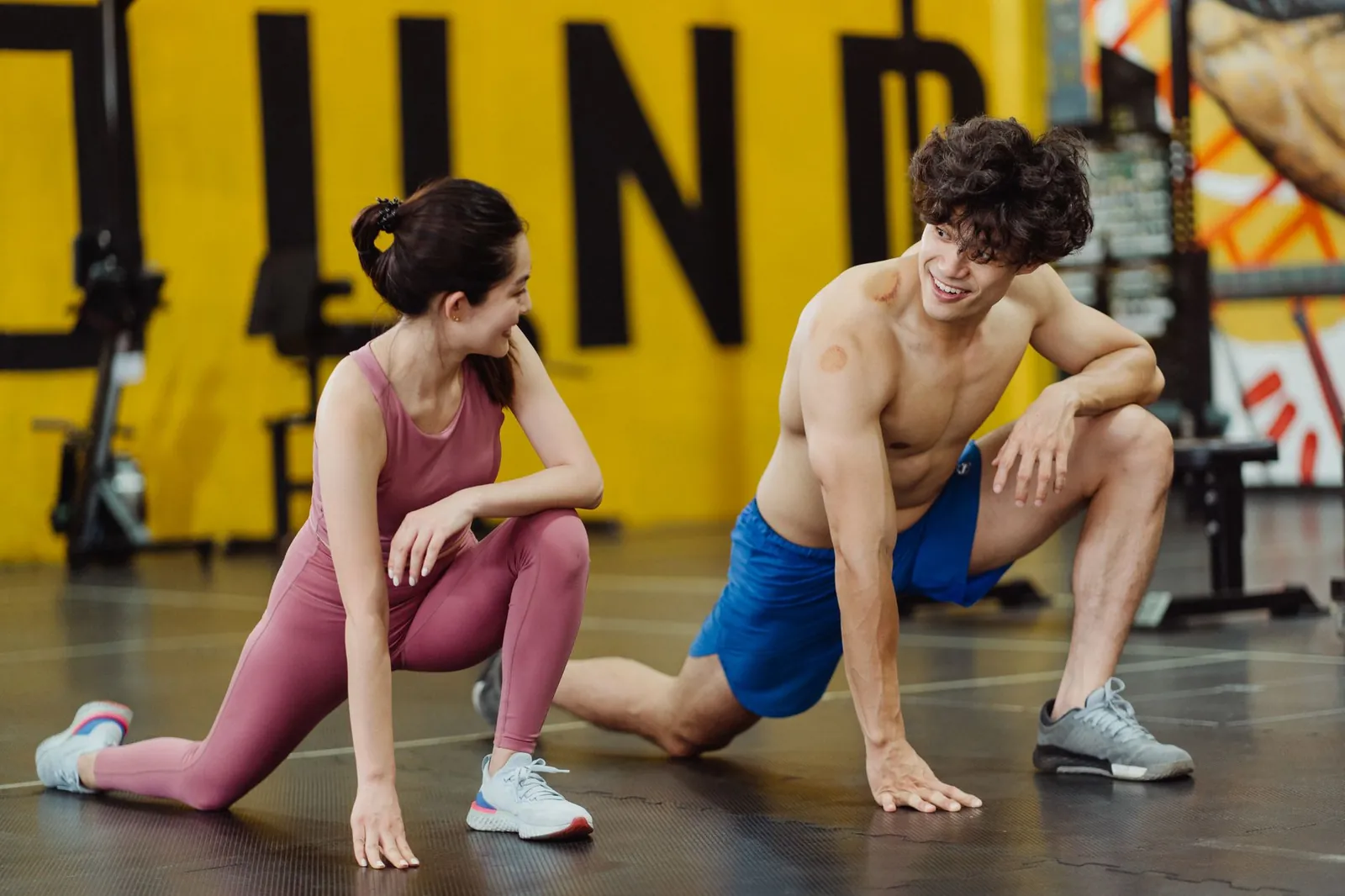 Person performing hybrid workout with kettlebell finisher after strength block at gym