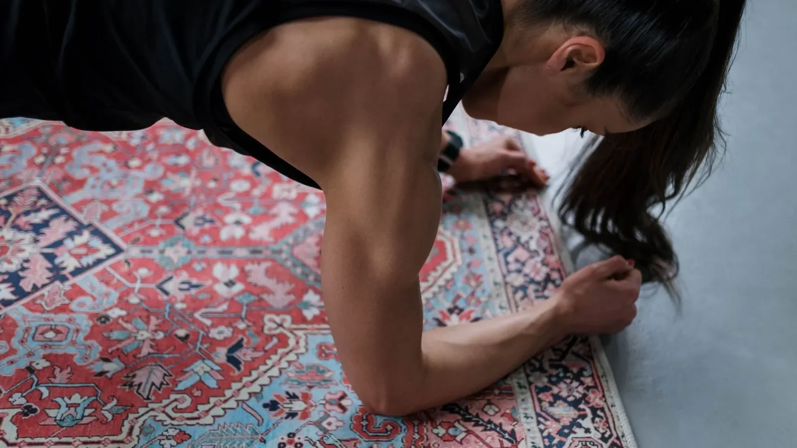 Athlete performing an archer push-up with controlled tempo, demonstrating bodyweight progressive overload