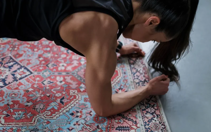 Athlete performing an archer push-up with controlled tempo, demonstrating bodyweight progressive overload