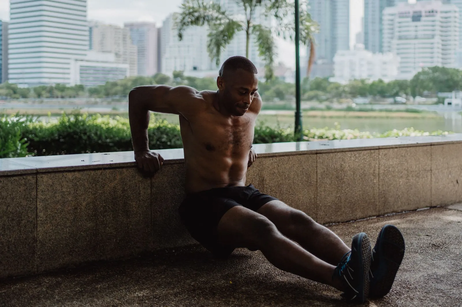 Athlete performing an archer push-up with controlled tempo, demonstrating bodyweight progressive overload