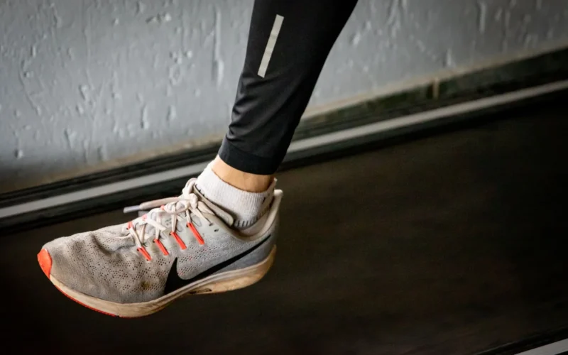 Wet footprint on cardboard showing neutral, overpronation, and underpronation gait patterns side by side