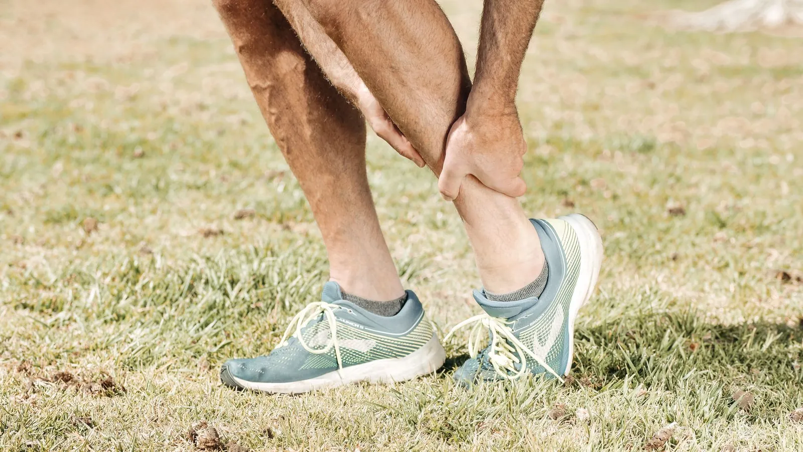 Runner reviewing weekly mileage totals on a training app to stay within the 10% progression rule