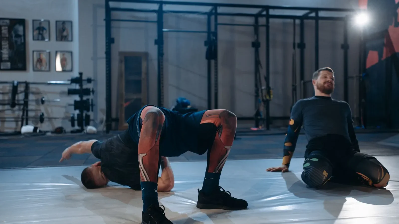 Lifter performing dynamic leg swings as part of a structured warm-up before a strength training session