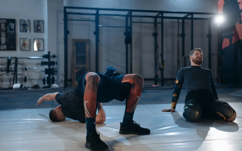 Lifter performing dynamic leg swings as part of a structured warm-up before a strength training session
