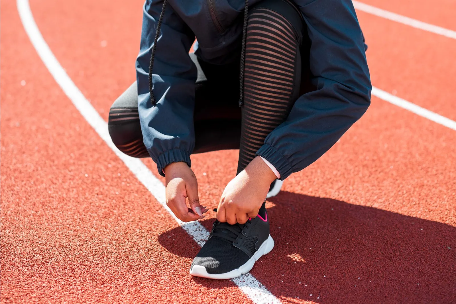 Side-by-side comparison of 2024 carbon-plate racing shoes showing thinner plate design and segmented forefoot and midfoot zones