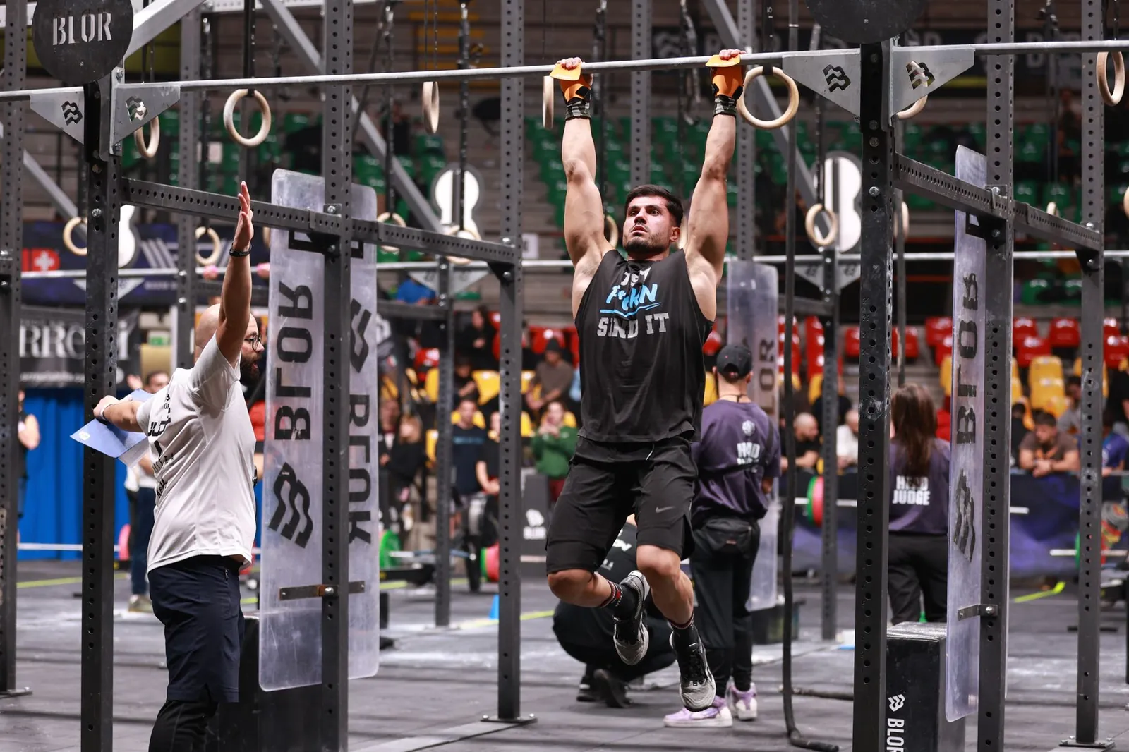 Athlete executing barbell back squat at controlled depth on leg day of push pull legs split